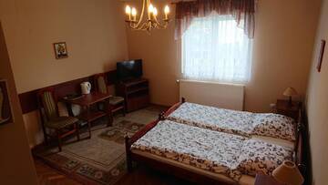 Фото номера Стандартный двухместный номер с 1 кроватью или 2 отдельными кроватями Проживание в семье Apartamenty Willa Dafne г. Цехоцинек 4